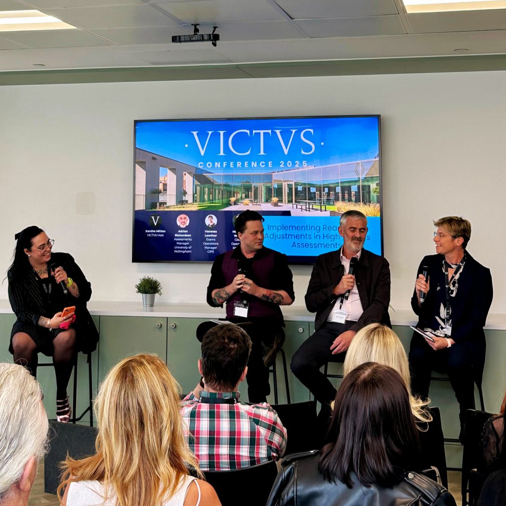 A panel discussion featuring esteemed guests at the first ever VICTVS conference. Four people sit on stools, all smiling.