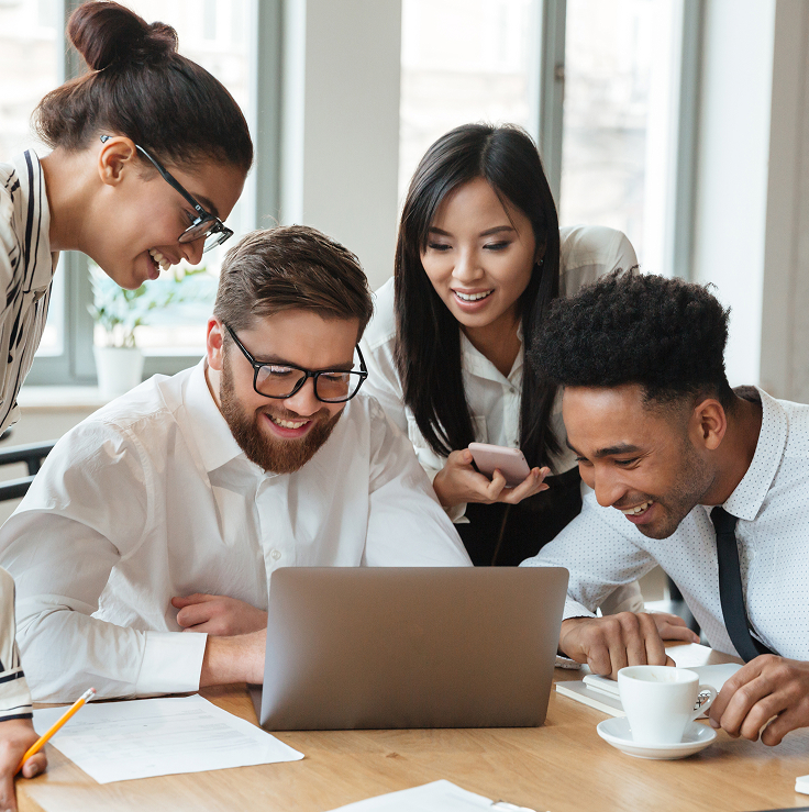 Group of people looking at laptop screen
